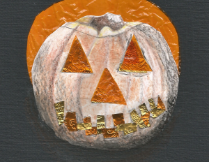 Image of a carved pumpkin made in mixed media