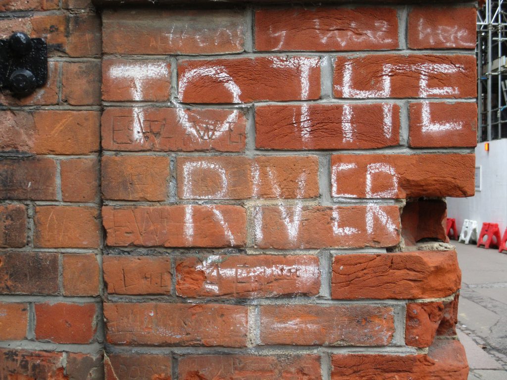 Photograph of hand-drawn sign on a Cambridge wall